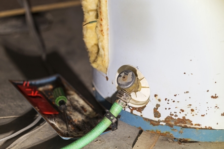 A domestic water heater leaking.